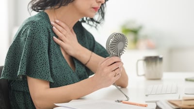 Hot flushes can be debilitating for some women, which has increasingly led to conversations around menopause support at the workplace. Getty Images