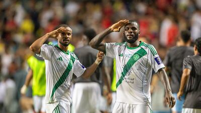 Al Ahli's Franck Kessie, right, celebrates with Ali Majrashi after scoring during the Saudi Super Cup final. Getty Images