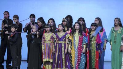 Children sing the UAE National Anthem at the beginning of the awards. Victor Besa / The National