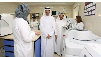 Dr Hanif Hassan Ali, centre, the Minister of Health, attends the opening of the Al Qarain Health Care Centre in Sharjah with Dr Mahmoud Fikri, second from right, the chief executive for health policies affairs, Ministry of Health.