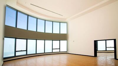 This six-bedroom, eight bathroom unit has a double-height living room with a massive window as its focal point. Courtesy Crompton Partners