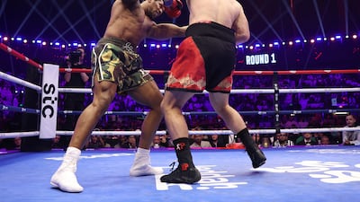 Anthony Joshua and Kristian Prenga exchange. Getty Images