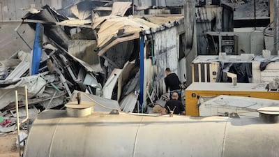 People check the damage outside the Kamal Adwan hospital in Beit Lahia in the northern Gaza Strip, following an Israeli strike, on December 6. AFP
