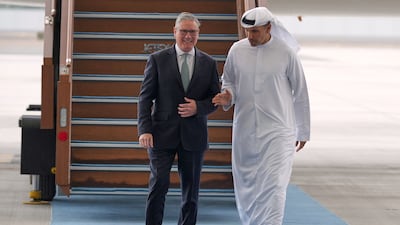 UK Prime Minister Keir Starmer is welcomed by Khaldoon Al Mubarak, chairman of the Executive Affairs Authority, at the airport in Abu Dhabi. Reuters