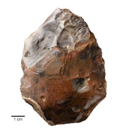 A heat-shattered handaxe found near a 400,000 year old campfire at Barnham, Suffolk. AP