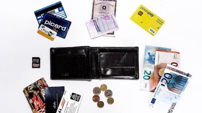 This wallet belongs to Andrea, 32, from Milan Italy, a photographer with a monthly income of 1,000 to 1,500 euros.