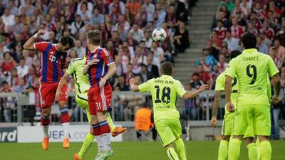 Mehdi Benatia of Bayern Munich heads in the opening goal on Tuesday against Barcelona in their Champions League contest. Adam Pretty / Bongarts / Getty Images
