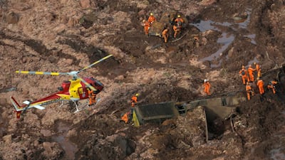 Rescue crew work dig through the sludge from a burst dam owned by Brazilian miner Vale SA Reuters