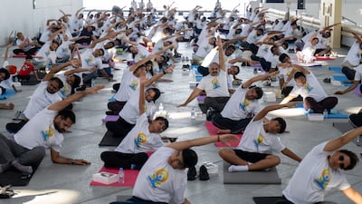Participants gather under the dome of Louvre Abu Dhabi for a special International Day of Yoga celebration.