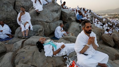 Pilgrims gather on Mount Arafat as the sun rises. Reuters