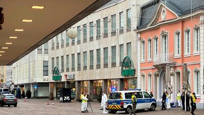 Police and forensic police investigate at one of the scenes where a car drove into pedestrians the center of Trier. AFP