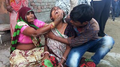 A woman cries after a wall collapsed during a wedding, killing at least 24 people, in Bharatpur in India's Rajasthan state on May 11, 2017. AFP