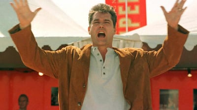 Liotta jokes with photographers before the screening of his film 'Cop Land '. AFP