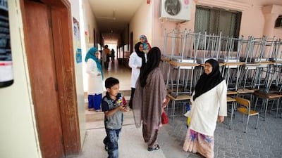 Teachers at Oasis School in Al Ain prepare to go home for the day.