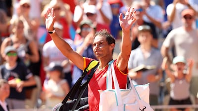 Rafael Nadal acknowledges the crowd at the stadium where he has won 14 of his 22 Grand Slam titles. Getty Images
