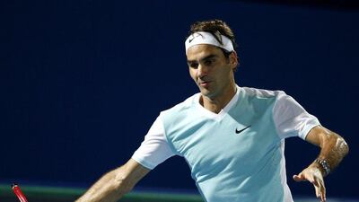 Switzerland's Roger Federer of Obi UAE Royals returns the ball to Croatia's Ivo Karlovic of Philippine Mavericks during their International Premier Tennis League (IPTL) tennis match on December 14, 2015 in the Emirate Dubai. AFP PHOTO / KARIM SAHIB