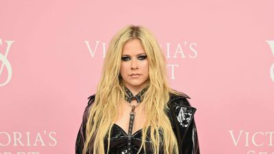 Avril Lavigne seems to have missed the mark, arriving in glossy faux-bondage garb. AFP