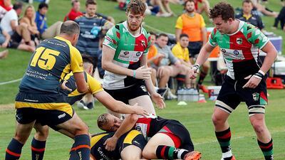 Abu Dhabi Harlequins, in green and red, face Jebel Ali Dragons in the UAE Premiership final on Friday. Satish Kumar for The National