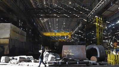 An employee walks through the Forge at Sheffield Forgemasters. Oli Scarff / AFP