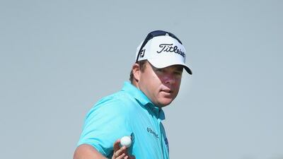 George Coetzee of South Africa waves to the crowd on the ninth hole during the second round of the Qatar Masters at Doha Golf Club on January 22, 2015 in Doha, Qatar. Andrew Redington / Getty Images