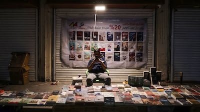 An Iraqi man sells books at his shop on Mutanabbi Street in Baghdad. AFP