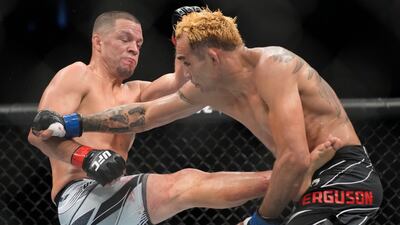 Nate Diaz kicks Tony Ferguson during their welterweight bout at UFC 279. AP