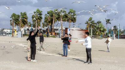 Cloudy and windy weather doesn’t deter visitors at Jumeirah open beach in Dubai. Leslie Pableo for The National
