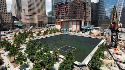 The 9/11 memorial, inspired by an impulse to preserve the terrible emptiness of the site as a reminder of the absence of the buildings, is due to open to the public on Monday. Mark Lennihan / AP