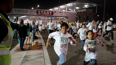 Many children took part in the 5K race at Yas Marina Circuit on Friday night. Christopher Pike / The National