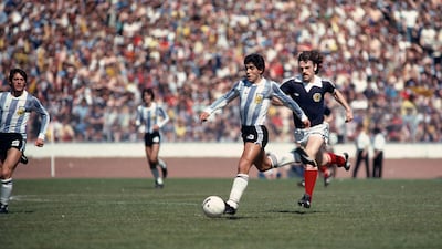 Argentina's Diego Maradona runs with the ball as Scotland's John Wark tries to keep up pn June 2, 1979. Maradona scored in a 3-1 victory for Argentina. Getty Images