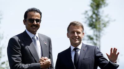 Sheikh Tamim with Mr Macron. EPA