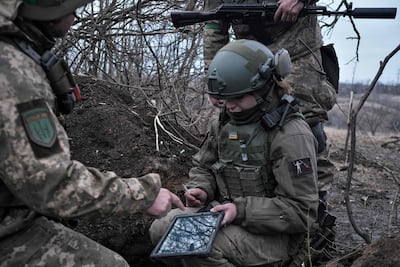 Soldiers of the Ukrainian Volunteer Army hold their positions at the front line near Bakhmut. AFP