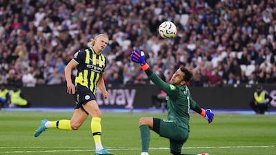 City striker Erling Haaland dinks the ball over West Ham's substitute goalkeeper Lukasz Fabianski to complete his hat-trick. PA