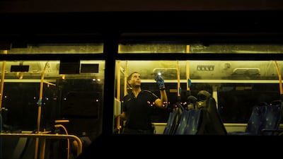 An Israeli police officer examines a bus after a shooting attack in Jerusalem. Reuters