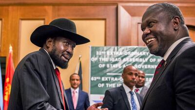 South Sudan's President Salva Kiir, left, and opposition leader Riek Machar shake hands during peace talks in Addis Ababa, Ethiopiam on June 21, 2018. AP Photo