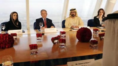 Sheikh Mohammed bin Rashid, Vice President of the UAE and Ruler of Dubai, President George W Bush, and Saeed al Muntafiq at a meeting earlier this year in Dubai with Najla al Awadhi, the deputy chief executive of Dubai Media Incorporated and a member of the Federal National Council (left) and Maha al Ghunaim, the founder and chairman of Kuwait's Global Investment House (right).