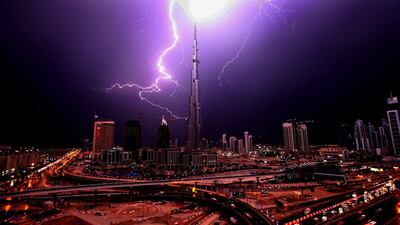 DUBAI-JANUARY 14,2009 - Web of lightning form over the Burj Khalifa. ( Paulo Vecina/The National )