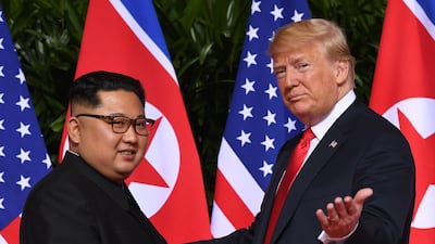 US President Donald Trump and Kim Jong Un at the start of their historic US-North Korea summit, at the Capella Hotel on Sentosa island in Singapore on June 12. AFP