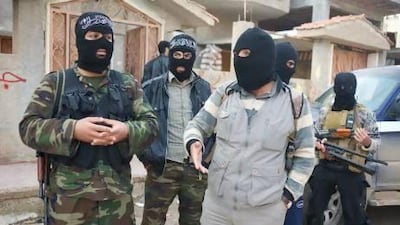 The man, who calls himself Sheikh Abu Ahmed alongside other member of Jabhat al Nusra.