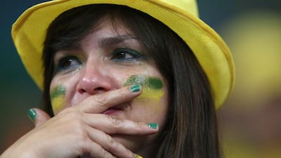 A Brazil fan reacts after Brazil's 7-1 loss to Germany in the 2014 World Cup semi-finals on Tuesday night in Belo Horizonte, Brazil. Fernando Bizerra Jr / EPA