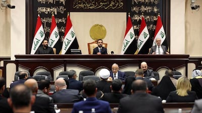 Iraqi Prime Minister Adel Abdul-Mahdi (centre, down) and Iraqi parliament speaker Mohamed al-Halbosi (centre, up) attending an Iraqi parliament session in Baghdad. Iraqi parliamentarians voted on a resolution to remove the US troops and cancel the security agreement between Iraq and US after the killing of Qassem Suleimani. EPA