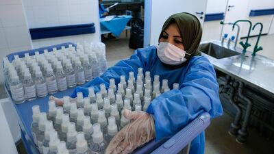 A nurse prepares bottles of sterilising fluid at the Benghazi Medical Centre in Benghazi, Libya. Reuters