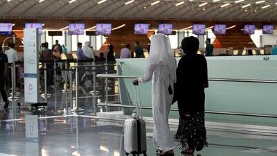 Passengers walk at Hamad International Airport in Doha, Qatar, June 7, 2017. REUTERS/Naseem Zeitoon