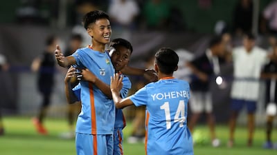 Player of Minerva Academy celebrate after winning the U12 Mina Cup final.