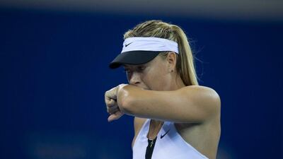 Maria Sharapova wipes her face during her match against Barbora Strycova at the WTA Wuhan Open last week. China Daily / Reuters / September 28, 2015
