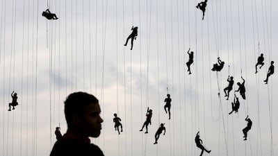 People climb after jumping off a bridge, which has a height of 30 meters, in Hortolandia, Brazil. Paulo Whitaker / Reuters