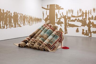 Turkey’s Hera Buyuktasciyan’s ‘Destroy Your House, Build Up a Boat, Save Life’ uses carpets embroidered with ethnic motifs from the Toronto area.