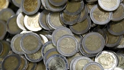 The euro took a hit amid German chancellor's troubles. Leonhard Foeger/Reuters