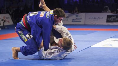 Marcus Vinicius Almeida takes down Alexander Trans in the open weight black final on Saturday at the Abu Dhabi World Professional Jiu-Jitsu Championship. Mona Al Marzooqi / The National