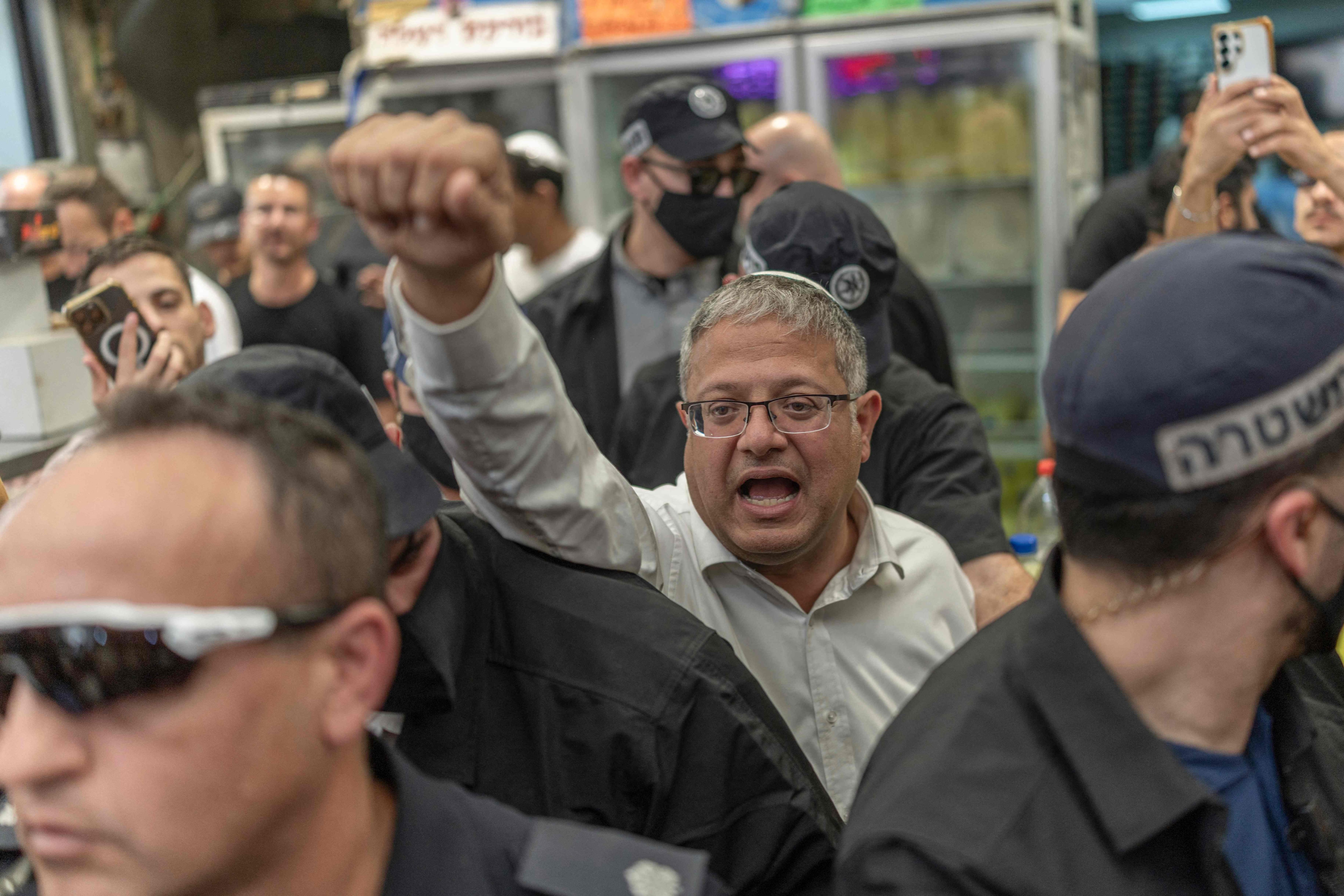 Itamar Ben-Gvir, centre, Israel's National Security Minister and head of the far-right Otzma Yehudit (Jewish Power) party, has overseen a crackdown that has hit the Israeli Arab community hard. AFP